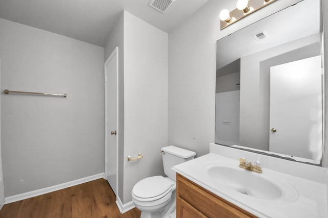 12047 Madison Oak St, Houston, TX 77038 - bathroom featuring wood finished floors, vanity, toilet, and baseboards