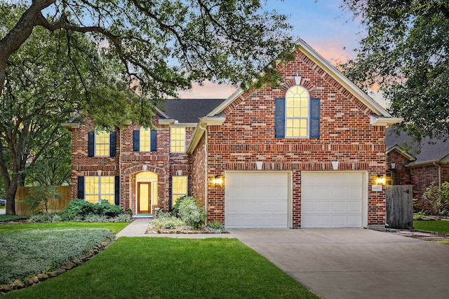 10607 Durbridge Ct, Houston, TX 77065 - view of front facade featuring an attached garage, driveway, brick siding, and roof with shingles