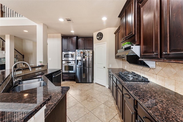 10827 Naburn Gate, Richmond, TX 77407 - kitchen featuring black appliances, a sink, backsplash, dark brown cabinets, and recessed lighting