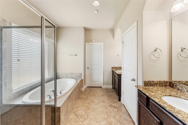 10827 Naburn Gate, Richmond, TX 77407 - full bathroom with two vanities, a bath, and a shower stall