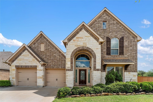 10827 Naburn Gate, Richmond, TX 77407 - french country inspired facade with stone siding, driveway, and brick siding