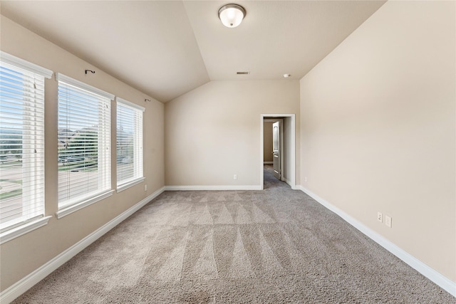 10827 Naburn Gate, Richmond, TX 77407 - unfurnished room with light colored carpet, vaulted ceiling, and baseboards