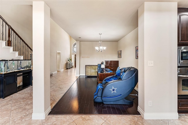 10827 Naburn Gate, Richmond, TX 77407 - living room with a chandelier, baseboards, light tile patterned floors, and stairway