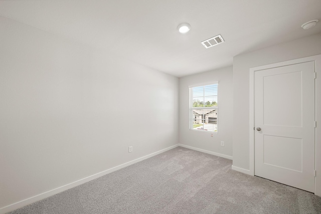 752 Westpointe Dr, Dayton, TX 77535 - unfurnished bedroom featuring light carpet and baseboards