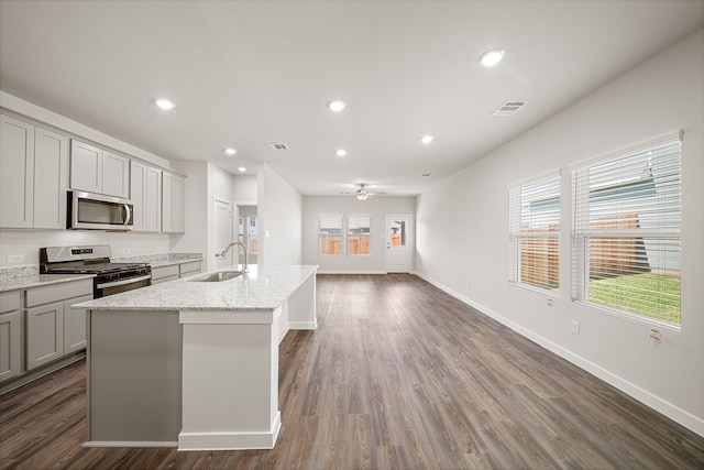 752 Westpointe Dr, Dayton, TX 77535 - kitchen with stainless steel appliances, gray cabinets, a sink, a kitchen island with sink, and ceiling fan