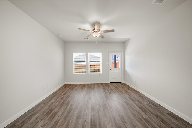 752 Westpointe Dr, Dayton, TX 77535 - empty room featuring dark wood-style floors, ceiling fan, and baseboards