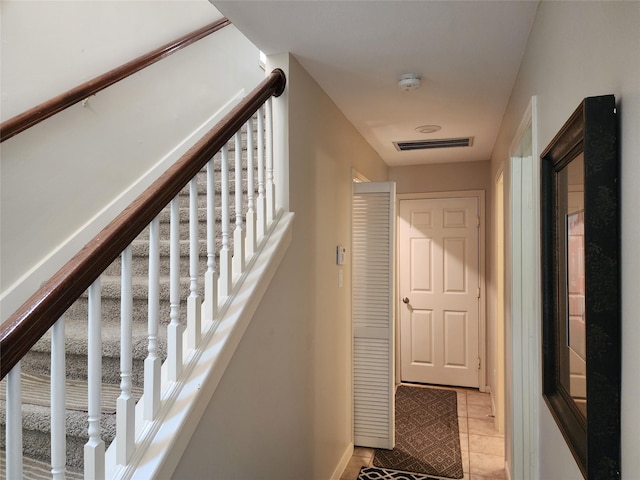 2722 Crawford St, Houston, TX 77004 - staircase featuring tile patterned floors and baseboards