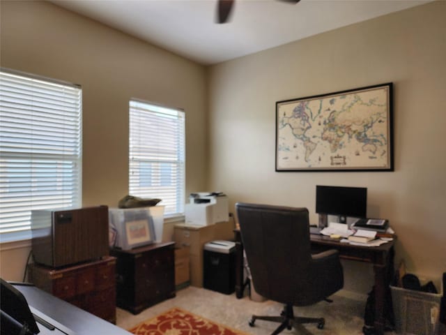 2722 Crawford St, Houston, TX 77004 - home office featuring a ceiling fan and light colored carpet