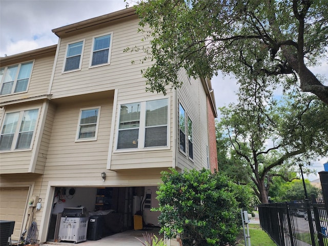 2722 Crawford St, Houston, TX 77004 - back of property featuring a garage and cooling unit