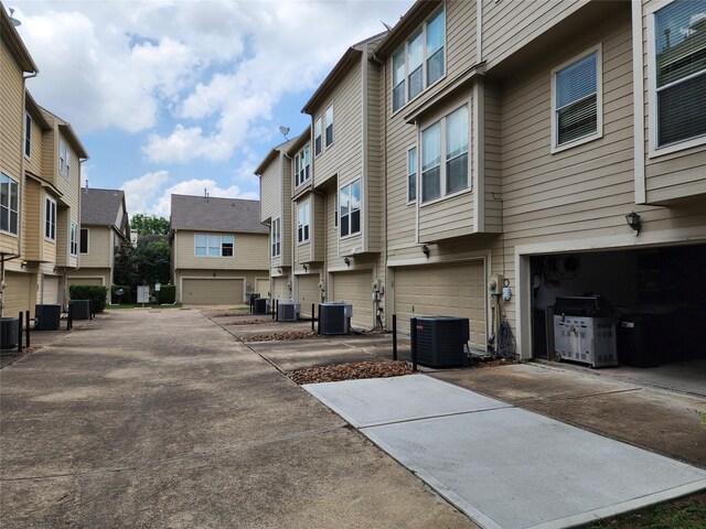 2722 Crawford St, Houston, TX 77004 - view of concrete driveway with a residential view