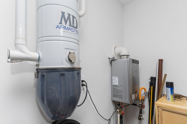 30114 Ousel Falls Ln, Fulshear, TX 77494 - detailed view of tankless water heater and a central vacuum unit