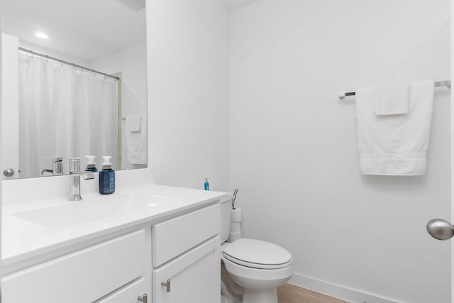 30114 Ousel Falls Ln, Fulshear, TX 77494 - full bath with vanity, toilet, wood finished floors, and recessed lighting