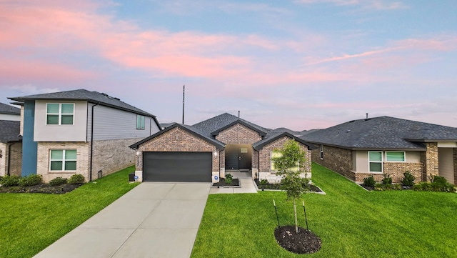 30114 Ousel Falls Ln, Fulshear, TX 77494 - view of front of property with an attached garage, driveway, a front lawn, and brick siding
