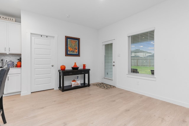 30114 Ousel Falls Ln, Fulshear, TX 77494 - foyer with light wood-style floors and baseboards