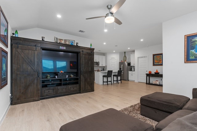 30114 Ousel Falls Ln, Fulshear, TX 77494 - living room with light wood-style floors, ceiling fan, recessed lighting, baseboards, and vaulted ceiling
