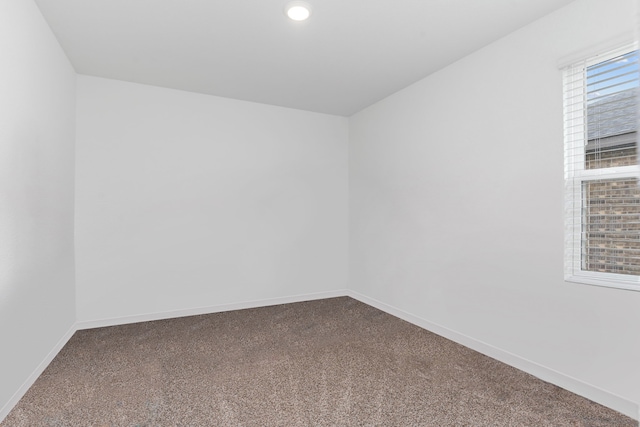 30114 Ousel Falls Ln, Fulshear, TX 77494 - unfurnished room featuring dark colored carpet, baseboards, and recessed lighting