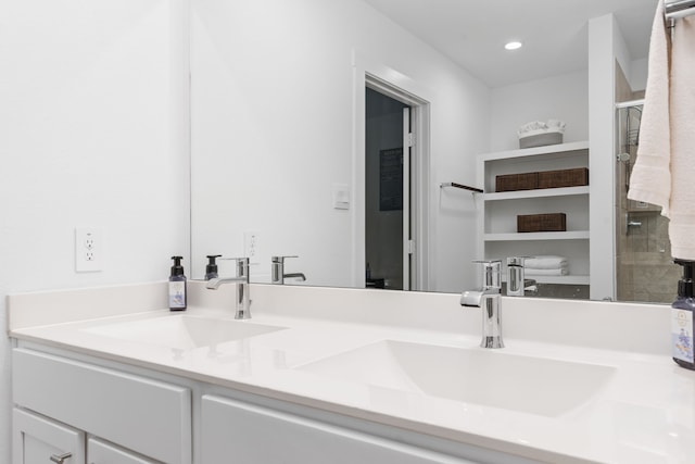30114 Ousel Falls Ln, Fulshear, TX 77494 - bathroom featuring double vanity, a stall shower, and recessed lighting