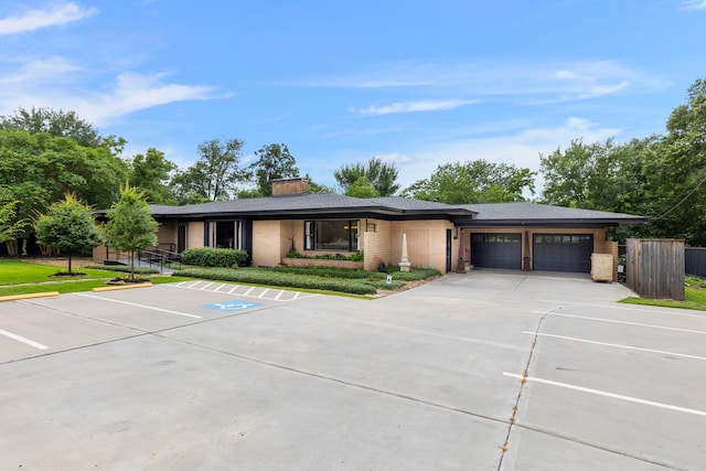 1403 N Thompson St, Conroe, TX 77301 - view of front of property with a chimney, uncovered parking, and brick siding