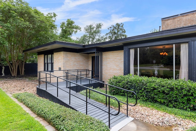 1403 N Thompson St, Conroe, TX 77301 - view of side of property featuring brick siding