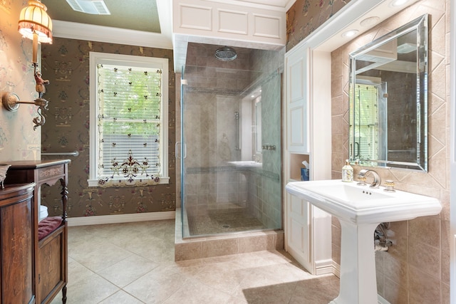1403 N Thompson St, Conroe, TX 77301 - bathroom with a stall shower, tile patterned floors, ornamental molding, wallpapered walls, and baseboards