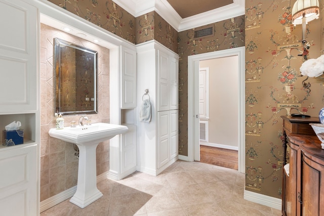 1403 N Thompson St, Conroe, TX 77301 - bathroom with tile patterned flooring, crown molding, and wallpapered walls