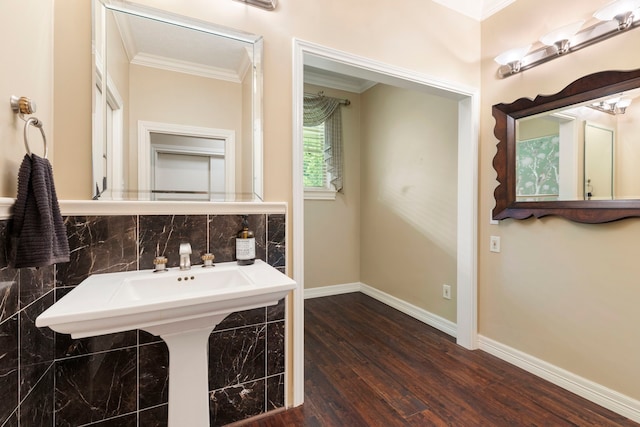 1403 N Thompson St, Conroe, TX 77301 - bathroom with ornamental molding, wood finished floors, baseboards, and tasteful backsplash