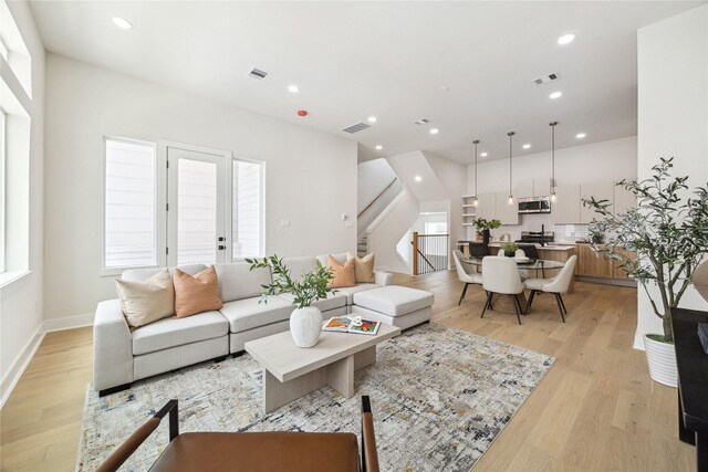 3907D Tulane St, Houston, TX 77018 - living room with stairway, light wood-style floors, recessed lighting, and baseboards