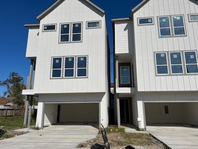 1803 Brooks St, Houston, TX 77026 - view of front of property with an attached garage and concrete driveway