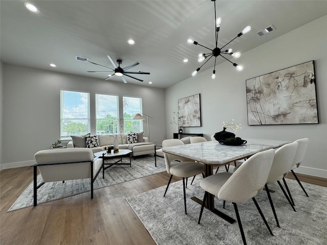 1803 Brooks St, Houston, TX 77026 - dining area featuring baseboards, wood finished floors, recessed lighting, a chandelier, and a ceiling fan