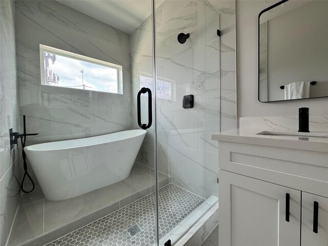 1803 Brooks St, Houston, TX 77026 - bathroom with a freestanding bath, vanity, and a marble finish shower