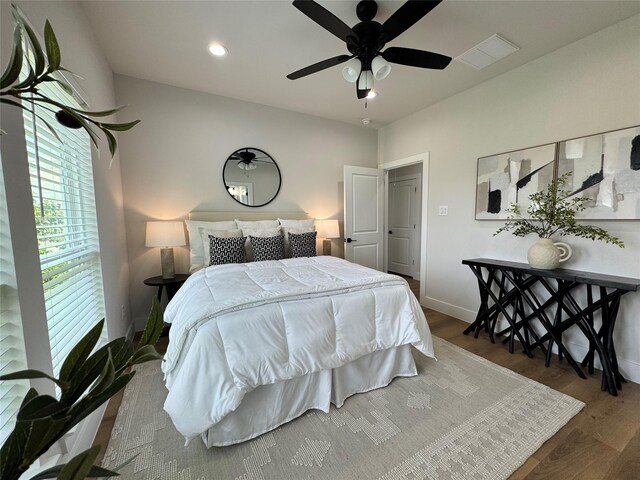 1803 Brooks St, Houston, TX 77026 - bedroom with wood finished floors, baseboards, recessed lighting, and a ceiling fan