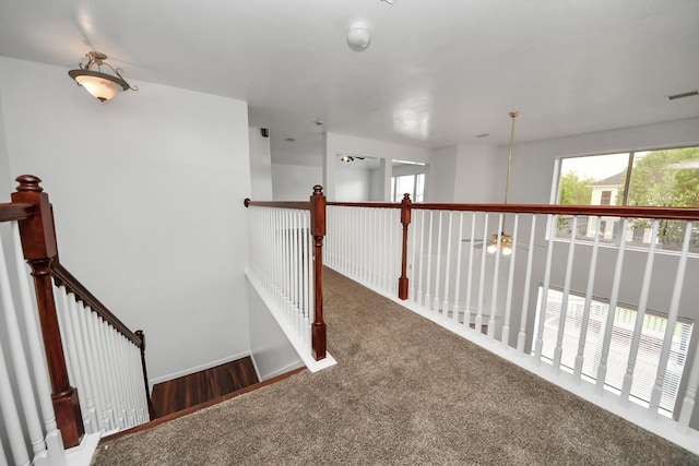 1605 Spring Glen Ln, Pearland, TX 77581 - corridor featuring carpet, plenty of natural light, an upstairs landing, and baseboards