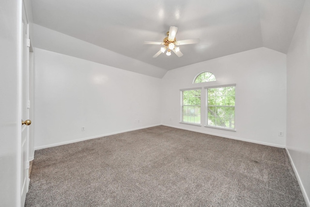 1605 Spring Glen Ln, Pearland, TX 77581 - empty room with vaulted ceiling, carpet, a ceiling fan, and baseboards