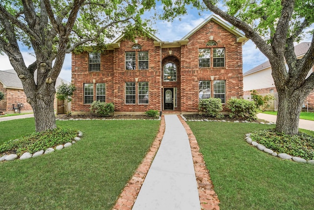 1605 Spring Glen Ln, Pearland, TX 77581 - view of front of house with a front yard and brick siding