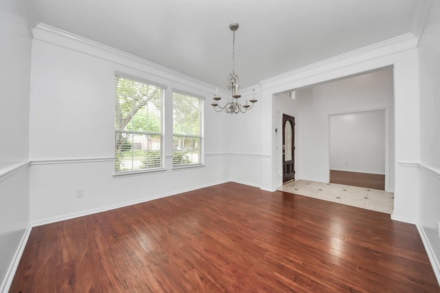 1605 Spring Glen Ln, Pearland, TX 77581 - unfurnished room with a chandelier, crown molding, wood finished floors, and baseboards