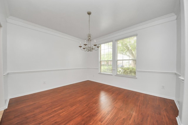 1605 Spring Glen Ln, Pearland, TX 77581 - spare room with ornamental molding, a chandelier, wood finished floors, and baseboards