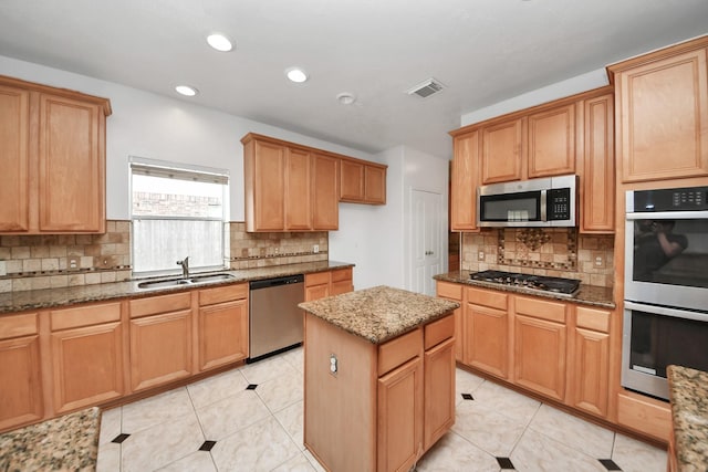 1605 Spring Glen Ln, Pearland, TX 77581 - kitchen with appliances with stainless steel finishes, a sink, stone countertops, tasteful backsplash, and recessed lighting
