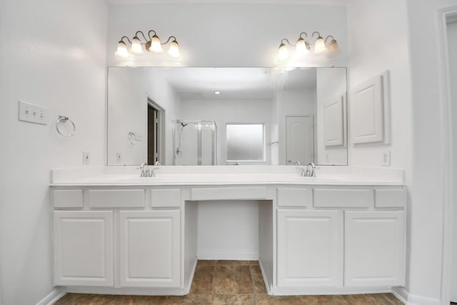1605 Spring Glen Ln, Pearland, TX 77581 - full bathroom featuring double vanity, baseboards, and a shower with door