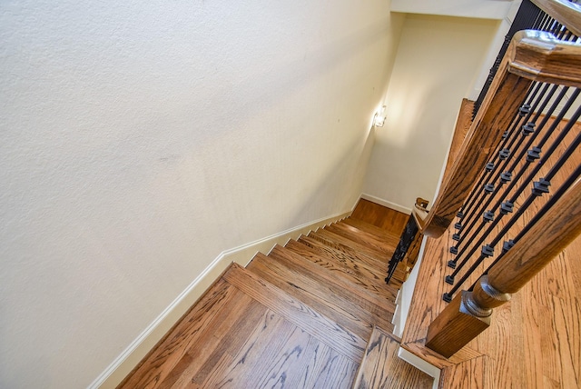 4220 Law St, Houston, TX 77005 - stairway featuring baseboards and wood finished floors