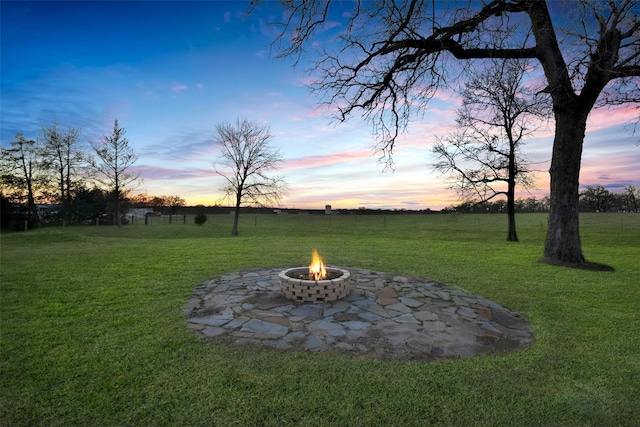 4620 Springfield Ln, Brenham, TX 77833 - yard at dusk featuring a fire pit and a yard