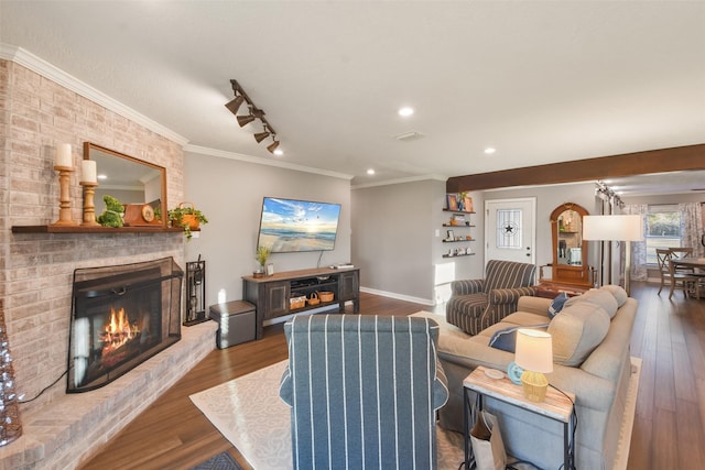 4620 Springfield Ln, Brenham, TX 77833 - living area with a fireplace, wood finished floors, crown molding, recessed lighting, and baseboards