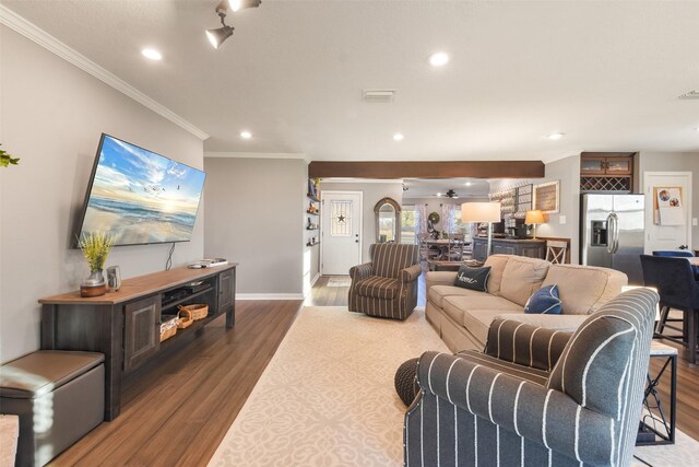 4620 Springfield Ln, Brenham, TX 77833 - living room with ornamental molding, wood finished floors, recessed lighting, and baseboards