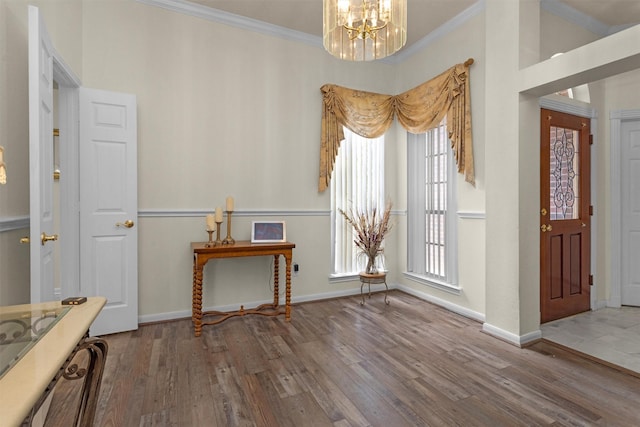 529 Stephen F Austin Dr, Conroe, TX 77302 - foyer entrance with a chandelier, wood finished floors, crown molding, and baseboards