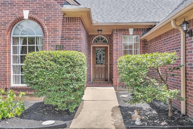 529 Stephen F Austin Dr, Conroe, TX 77302 - doorway to property with a shingled roof and brick siding