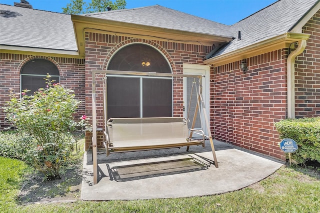 529 Stephen F Austin Dr, Conroe, TX 77302 - entrance to property featuring brick siding and roof with shingles