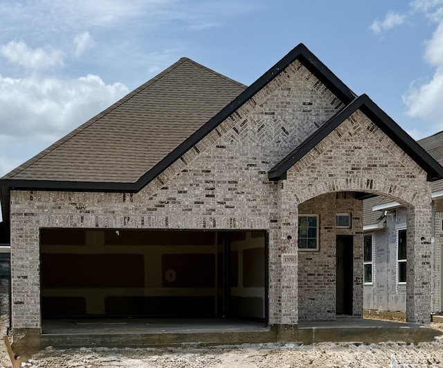 17051 Lilac Paxton Ln, Hockley, TX 77447 - view of property exterior with brick siding and roof with shingles