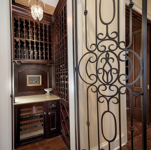 31 Southern Crescent Ct, The Woodlands, TX 77380 - wine area featuring wine cooler and dark wood finished floors