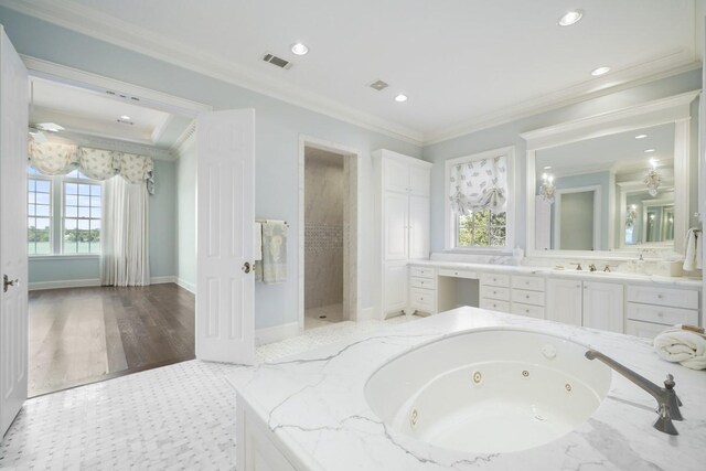 31 Southern Crescent Ct, The Woodlands, TX 77380 - bathroom featuring vanity, a whirlpool tub, ornamental molding, recessed lighting, and baseboards