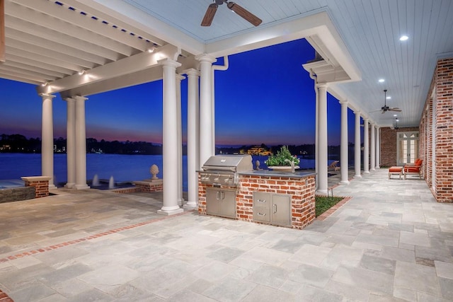 31 Southern Crescent Ct, The Woodlands, TX 77380 - view of patio / terrace with ceiling fan and a water view