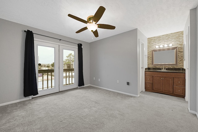 260 El Dorado Blvd Unit 205, Houston, TX 77598 - unfurnished bedroom with access to exterior, light colored carpet, baseboards, connected bathroom, and ceiling fan